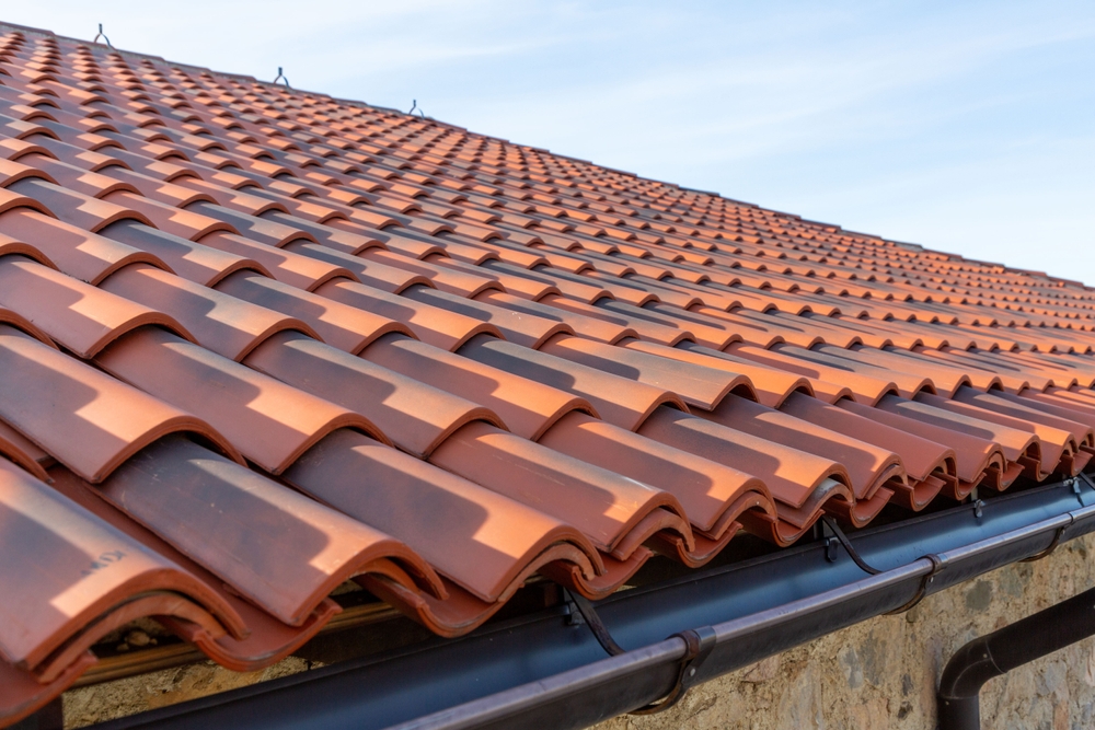 High-quality clay roof tiles installed in clean, even rows, providing durability, weather resistance, and timeless curb appeal – San Marcos Roofing.