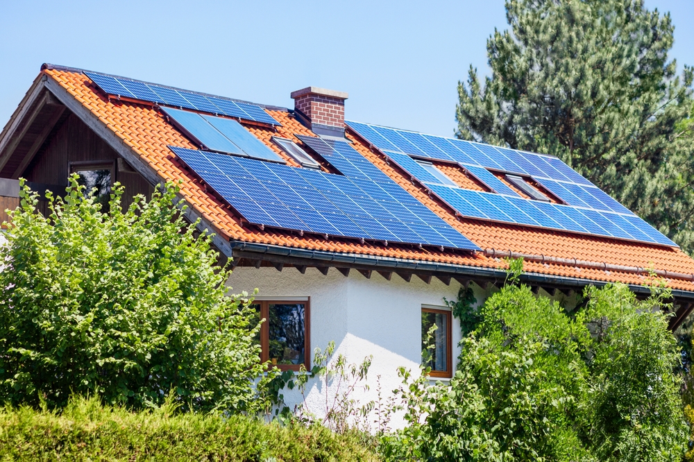 A modern home equipped with a rooftop solar energy system designed to improve efficiency and reduce energy costs through solar installation in San Diego